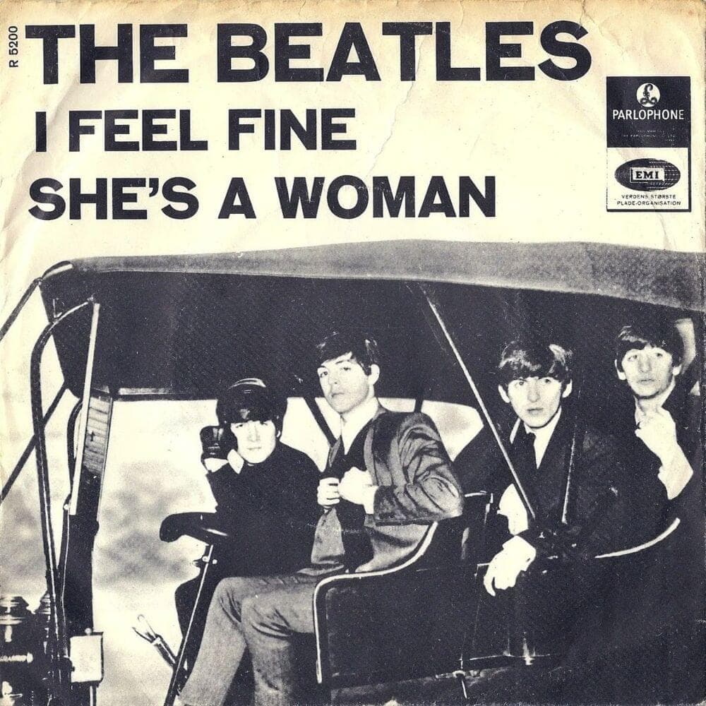 Album cover art for "She's a Woman" by The Beatles