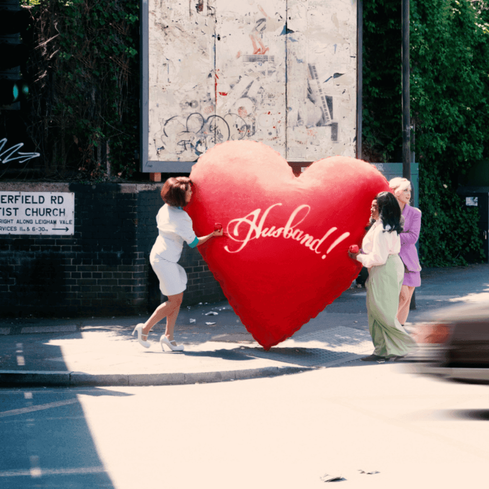 Album cover art for "WHERE IS MY HUSBAND!" by RAYE