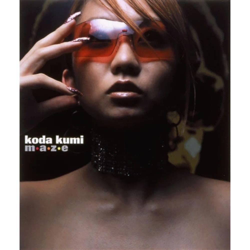 Album cover art for "m・a・z・e" by 倖田來未 (Kumi Koda)